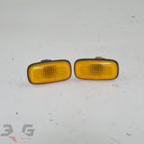 OEM factory front fender or guard side markers or indicator light units, as removed from a R34 chassis Nissan Skyline, years 1998 - 2002 with 3G Spares logo