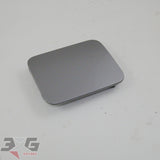 OEM factory gas or fuel filler door, as removed from an R34 chassis Nissan Skyline Sedan, years 1998 - 2002 with 3GSpares logo 