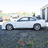 Nissan Silvia S14 left view – OEM taillights, aftermarket exhaust, visible body prep work