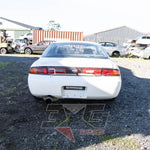 Nissan Silvia S14 rear view – OEM taillights, aftermarket Nismo exhaust, visible body prep work