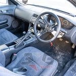 Nissan S14 interior cockpit – aftermarket steering wheel, 5-speed manual, partially dismantled front center console