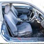 Silvia S14 front interior – striped cloth bucket seats and intact centre console, manual transmission