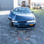 Front-on view of Silvia S14.5 showing heavy right-front crash damage to guard, bonnet, and bumper