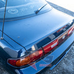 Close-up of Nissan Silvia S14.5 boot lid showing paint condition and factory taillight fitment