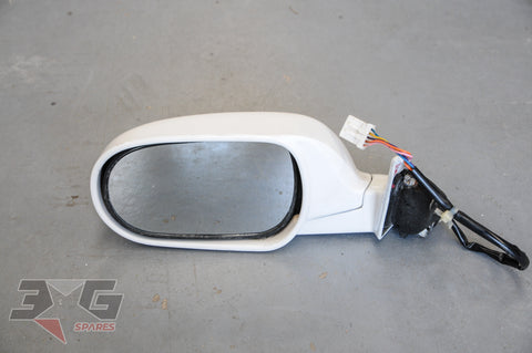 Used OEM Nissan R33 Skyline sedan left door mirror 96302‑15U01 in QM1 Cloud White, good condition with original mounting bracket.