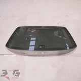 OEM factory rear privacy tint windscreen glass, as removed from a R34 chassis Nissan Skyline Sedan, years 1998 – 2002.
The tint on this glass is much darker than the factory untinted glass, with 3GSpares  logo