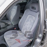 Nissan HR34 Skyline GT seat upholstery close-up — factory cloth