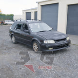 1998 Toyota AE111G Sprinter Carib BZT front-right exterior — 205 Satin Black Metallic — 3GSpares NZ