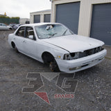 1997 Nissan Laurel HC34 Medalist front three-quarter driver's side, rollover damage to windscreen and roof, front end stripped, wheels removed — 3GSpares NZ