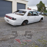 1997 Nissan Laurel HC34 Medalist driver's side rear three-quarter showing body panels and roof damage — 3GSpares NZ