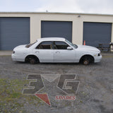 1997 Nissan Laurel HC34 Medalist driver's side showing body panels and roof damage — 3GSpares NZ