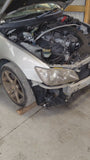 Exterior view of Toyota GXE10 Altezza on a dyno testing the J160 6 speed gearbox.